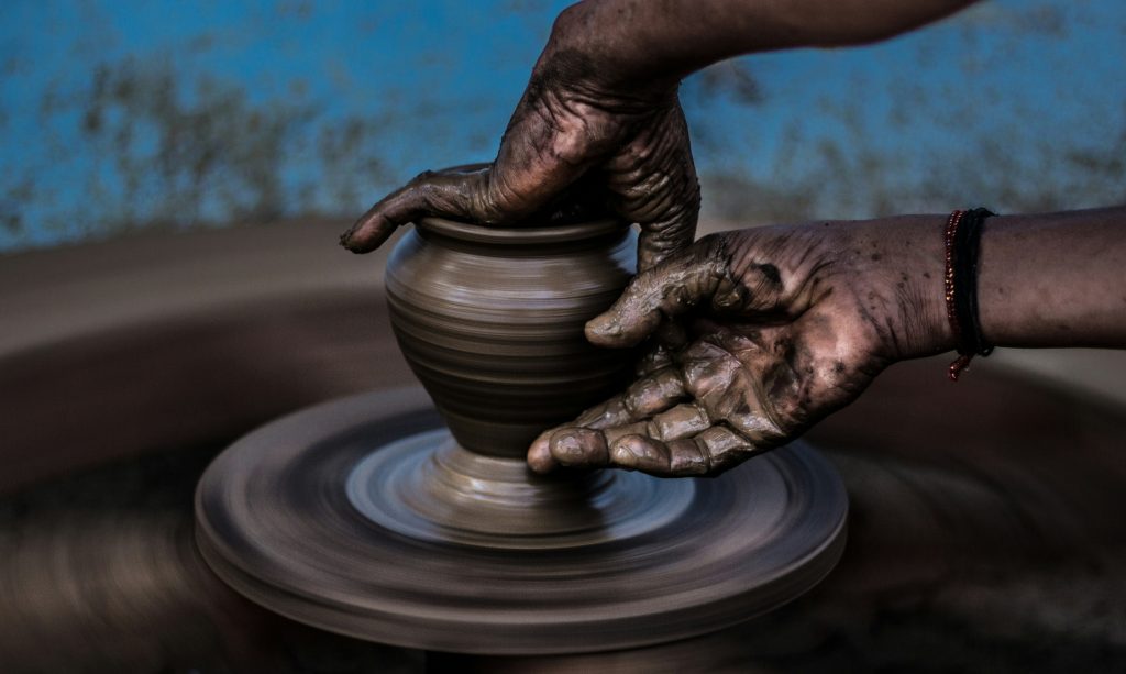 Potter with clay